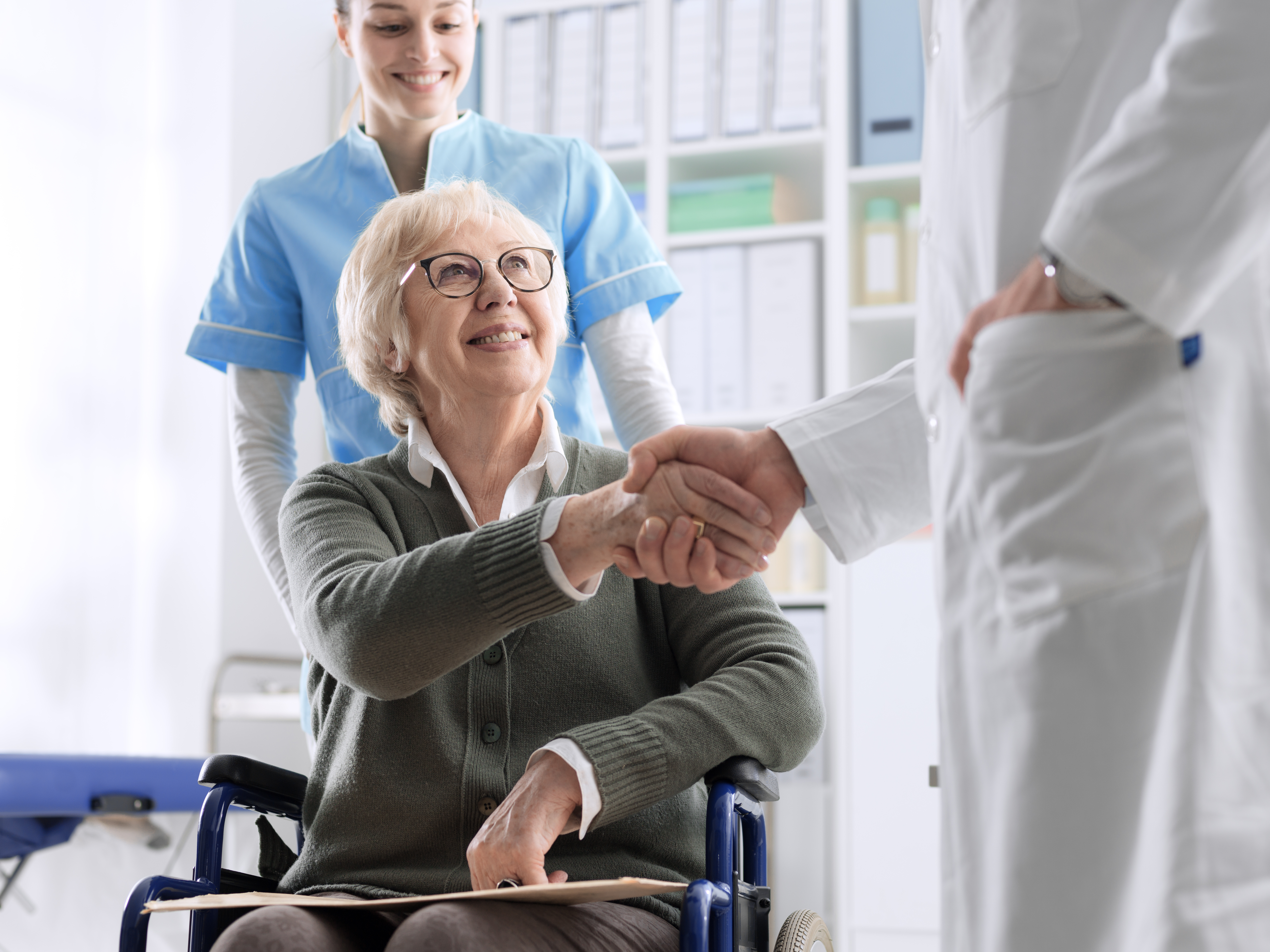 Doctor Giving A Handshake To Female Patient